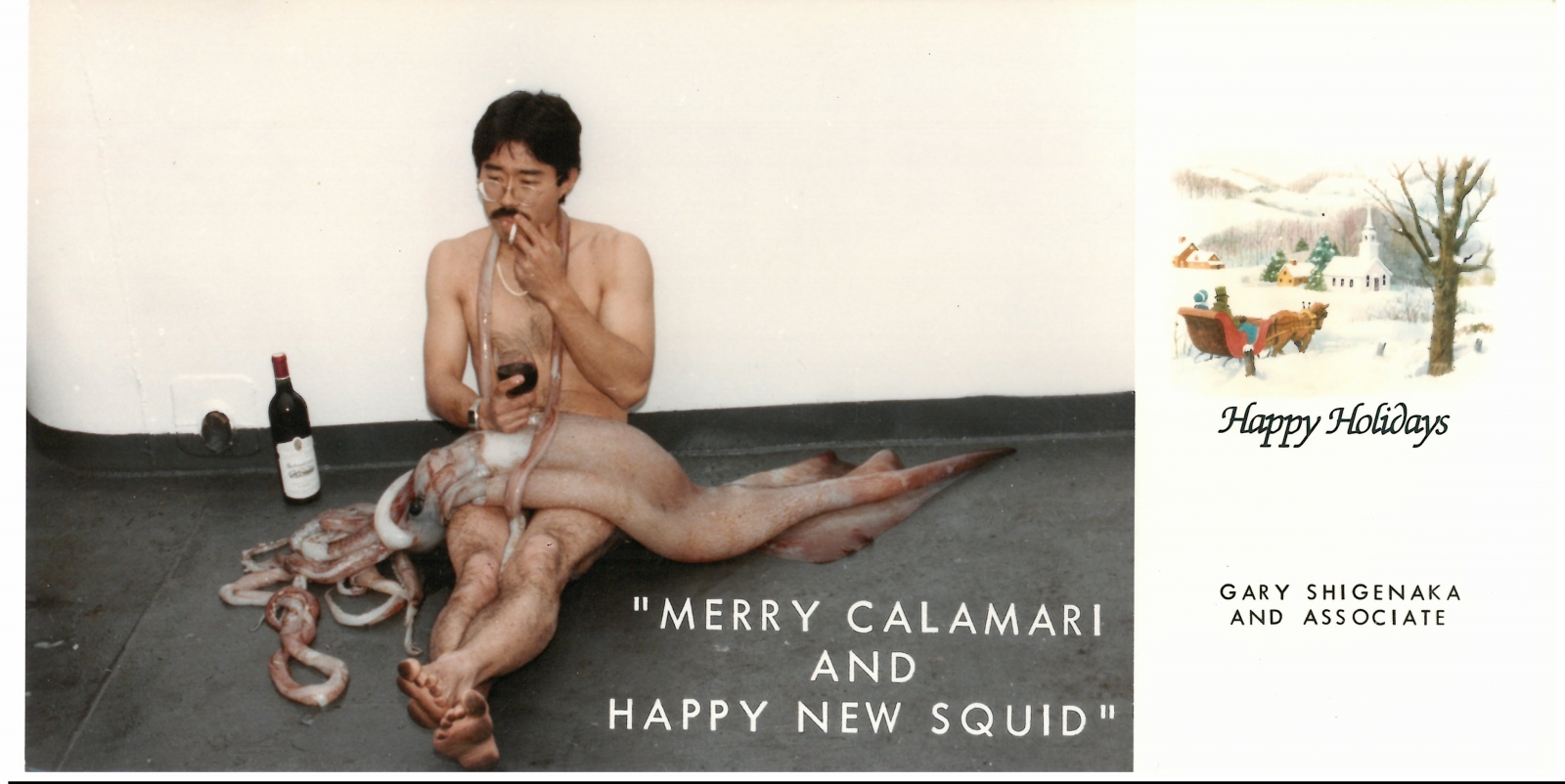 A man sitting on a vessel with a squid on his lap and a bottle of wine next to him.