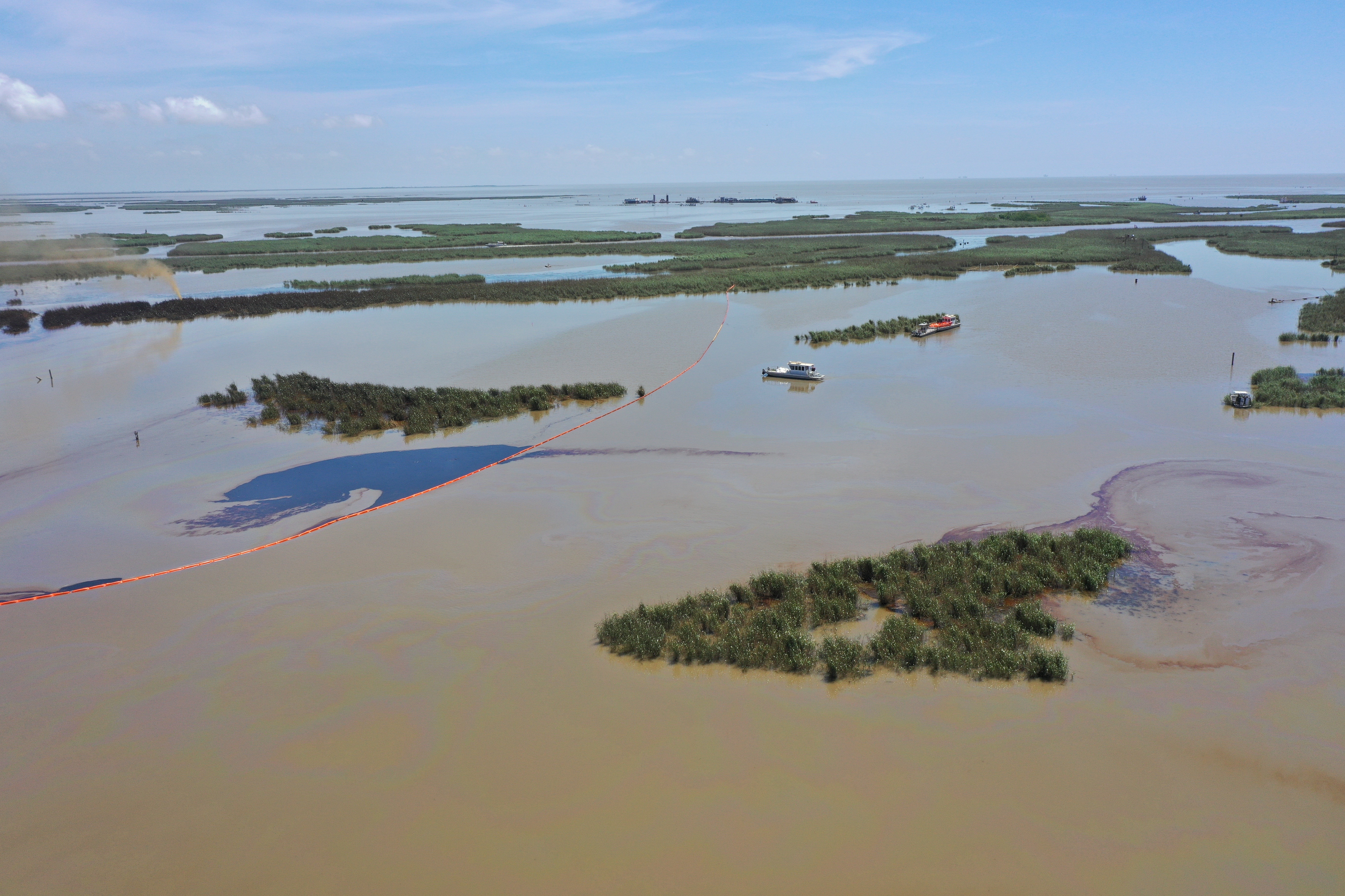 An overflight displays the affected area of marsh environment near Garden Island Bay, Louisiana on April 27, 2025. A safety zone has been enacted in the area and boom has been placed to contain the released product. Credit: U.S. Coast Guard. 