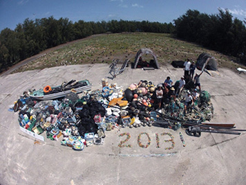 The 2013 NOAA team collected 14 metric tons of fishing gear, plastic, and other debris from the shoreline and waters around Midway Atoll.