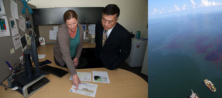 Left, woman pointing and explaining maps on desk to man. Right, dark brown and red oil on ocean surface with two response ships.