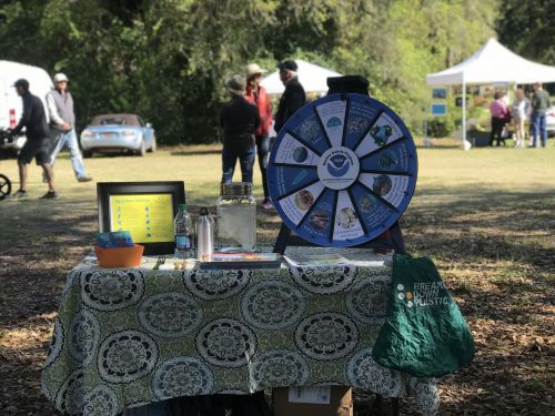 An exhibit table outdoors. 