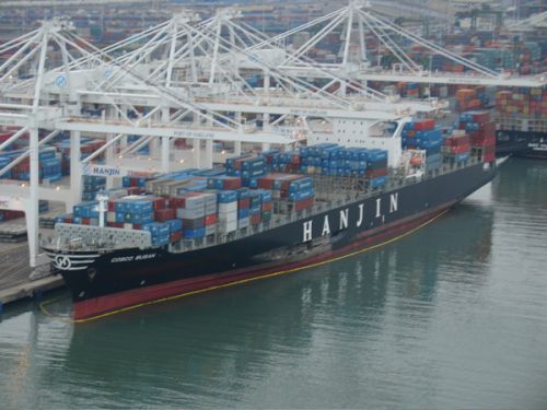 A shipping vessel being offloaded. 