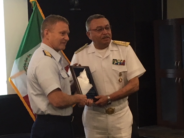 Two men in uniforms standing together.