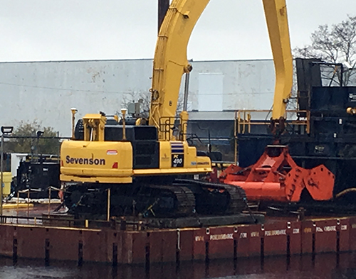 Heavy equipment at water's edge.