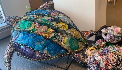 Turtle sculpture made of marine debris.