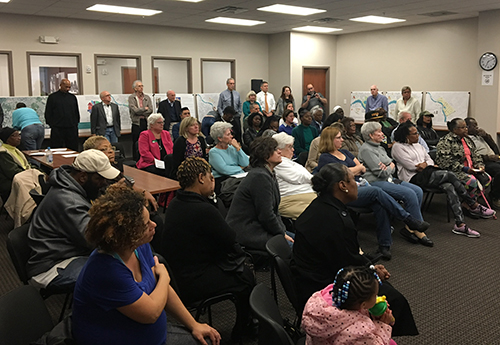 An audience listening in a room.