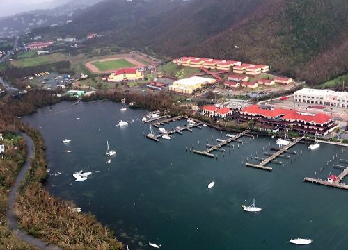 Aerial view of a harbor and boats.