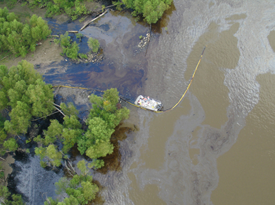 Aerial view of an oil spill in a river.