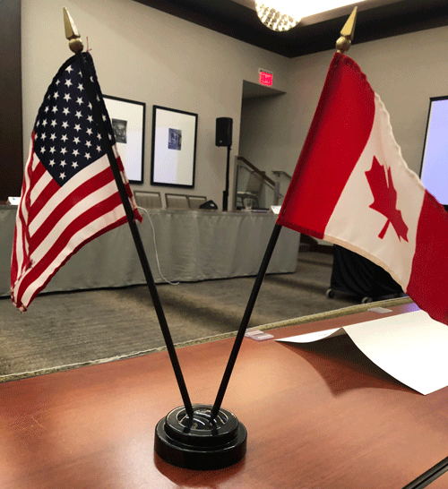 An American flag and a Canadian flag.