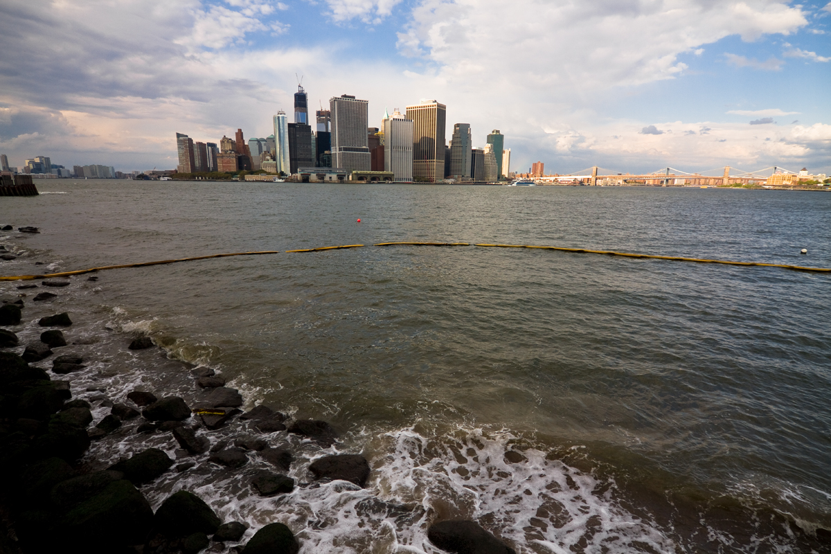 A city skyline as seen from across the water.