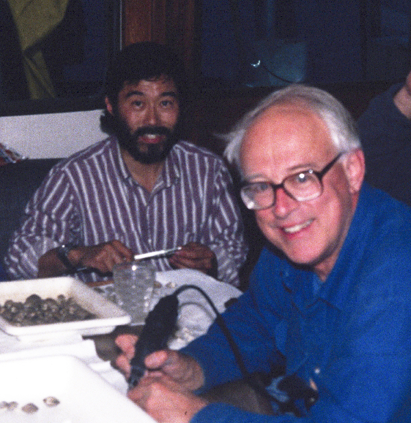 Two men sitting at a table.