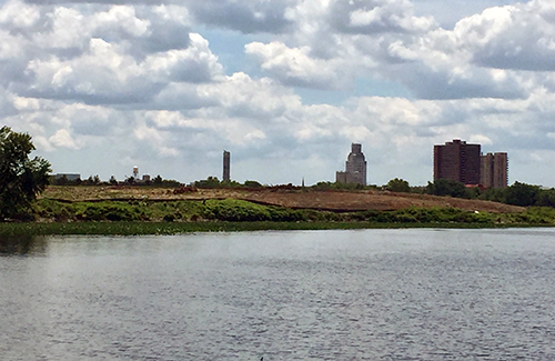 Riverbank and landscape from across river.