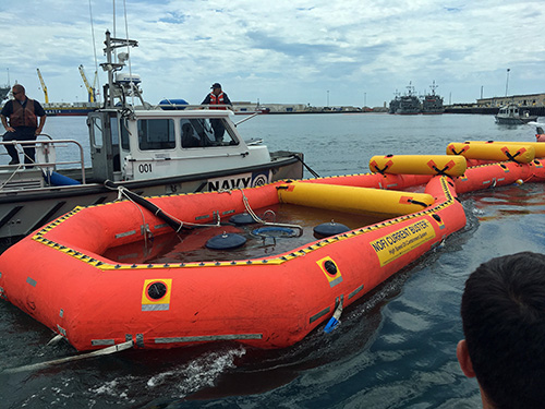 An inflatable with water in it floats in the water. 