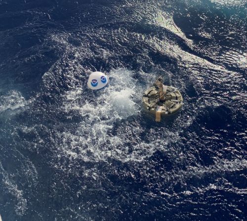 A NOAA drifter that looks like a beach ball-sized buoy in the ocean.