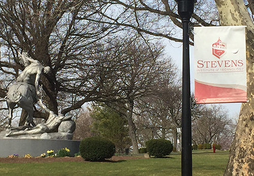 A statue and a sign outdoors.