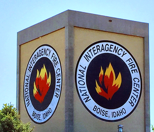 Tower with a sign with "National Interagency Fire Center" on it.