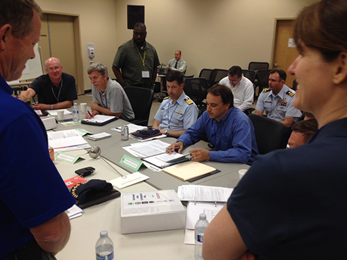 Participants around a table at spill drill.