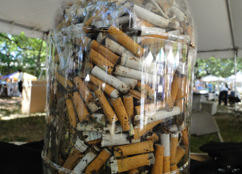 Jar of cigarette butts.