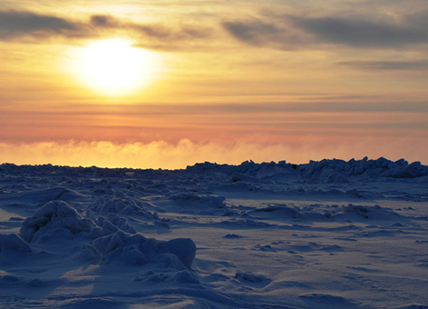 The snowy horizon outside Barrow, Alaska, at sunset.