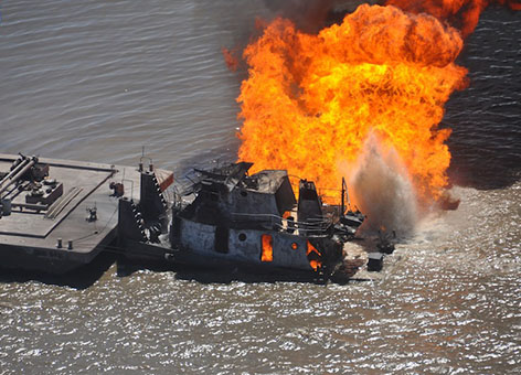 A pipeline burns after it was hit by the tug boat Shanon E. Setton in Louisiana.