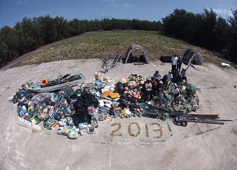 In 2013, a NOAA team collected 14 metric tons of marine debris from Midway Atoll