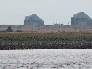 Two of Hanford's nuclear reactors sit decommissioned along the Columbia River.