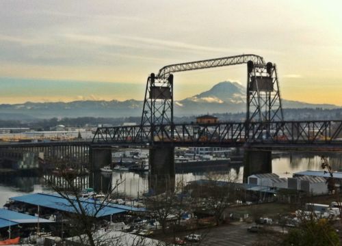 Bridge over industrial waterway in Tacoma and view of Mt. Rainier.