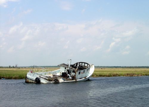 Derelict boat in a Gulf marsh.