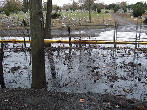 Boom placed to prevent floating oil from reaching a cemetery in New Jersey