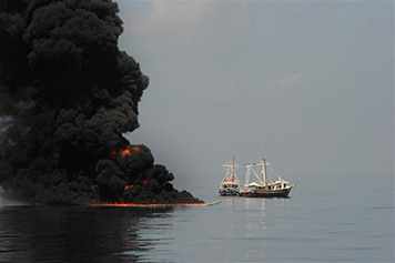 Photo: In situ burn with vessels looking on.