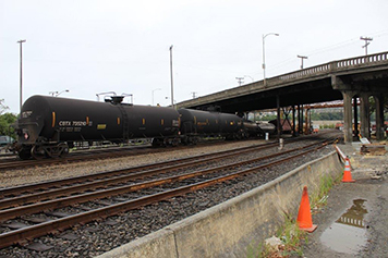 Derailed oil tanker cars beneath Seattle's Magnolia Bridge.