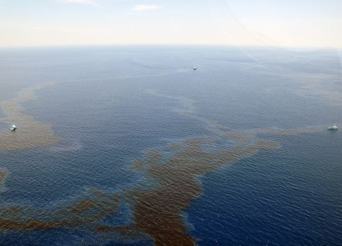 Vessels skim oil from the surface of the Gulf of Mexico.