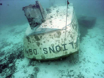 A steel sailboat sank on the sandy ocean bottom off Guam.