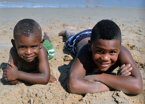 Two boys take a break on the beach in Ocean City, Maryland.