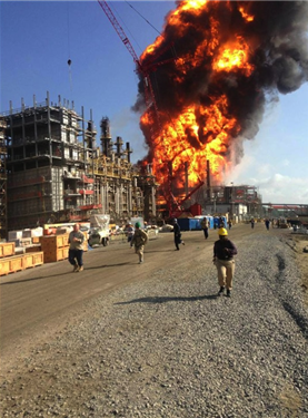 Fireball explosion at Louisiana chemical facility with people running.