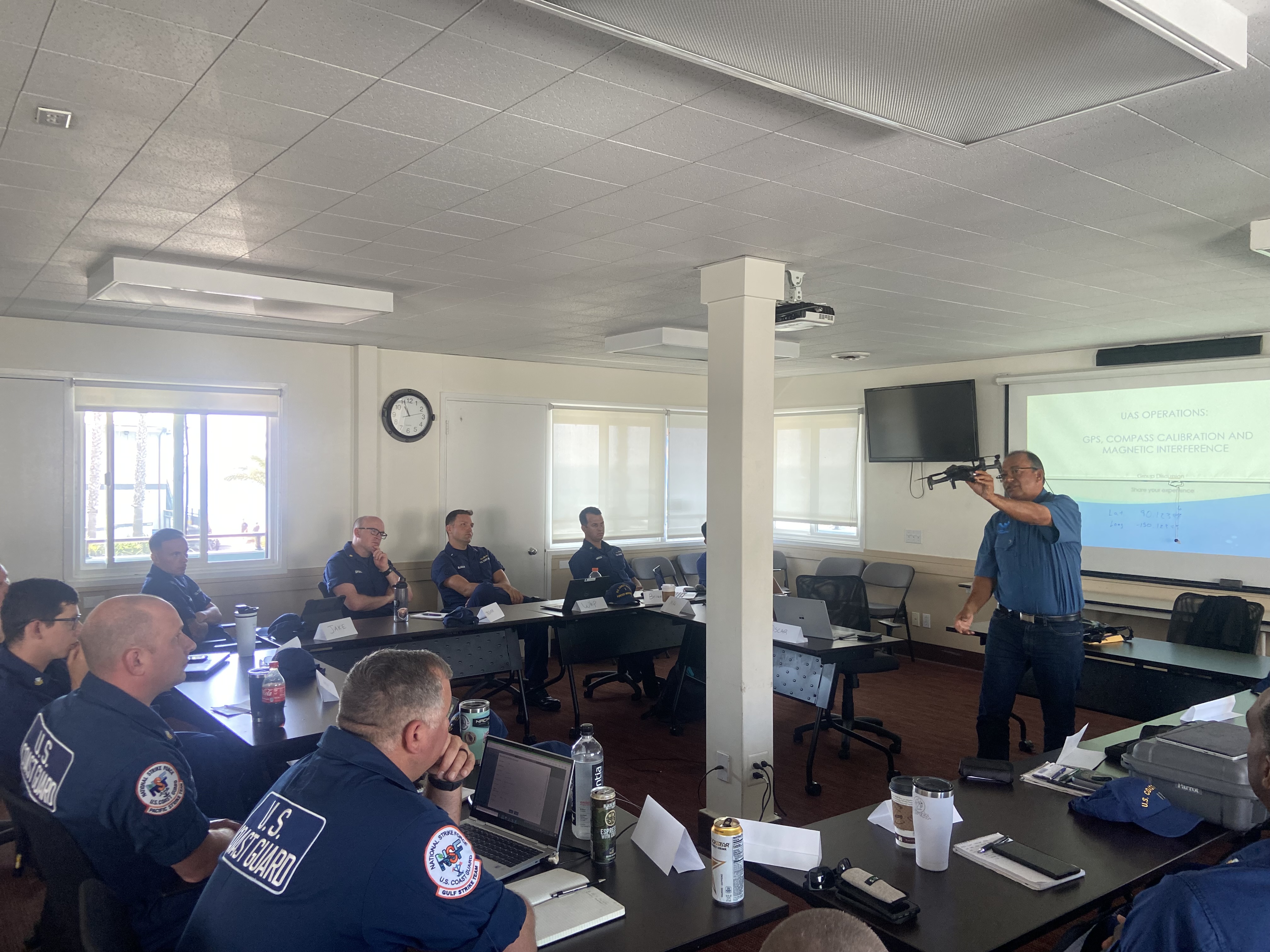 Flight instructor, Dr. Oscar Garcia-Pineda, leads ground school for UAS training team consisting of USCG UAS pilots and representatives from OR&R, USCG, and the Couvillion Group (Image Credit: NOAA). 