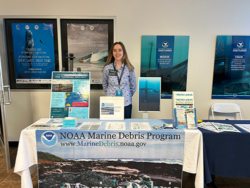 OR&R staff in front of NOAA's Marine Debris Program's booth. 
