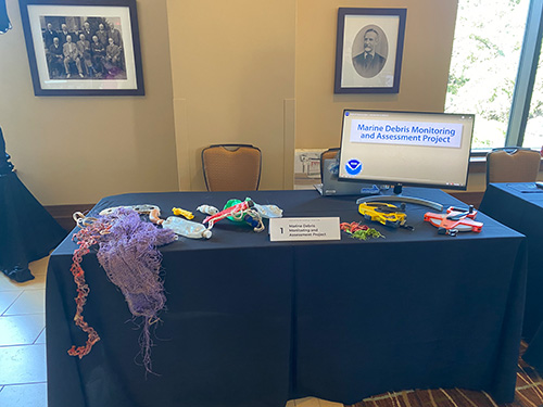 An educational display of the Marine Debris Monitoring and Assessment Project (MDMAP) for partners during the Tools Cafe (Credit: NOAA).