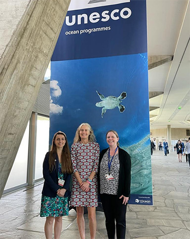 A photo of the NOAA delegation to INC-2 (L-R: Sammi Dowdell and Elizabeth McLanahan, NOAA/OIA; Nancy Wallace, NOS/ORR/MDP) (Credit: NOAA).