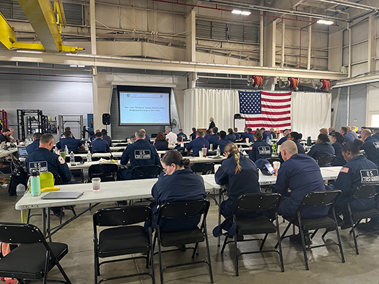 Participants of the Response Roadshow gathered around tables at the U.S. Coast Guard Atlantic Strike Team in Ft. Dix, New Jersey.