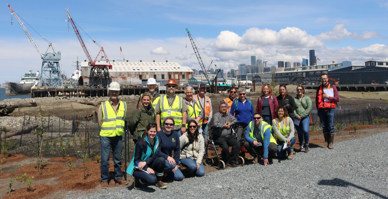 A team of NOAA staff outside a construction zone. 
