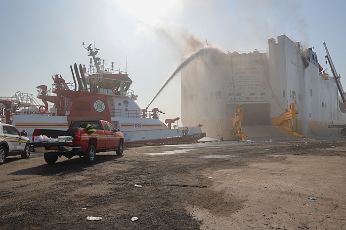 Fire fighting crews work to extinguish the fire aboard the car carrier Grande Costa D'Avorio. Image credit: USCG