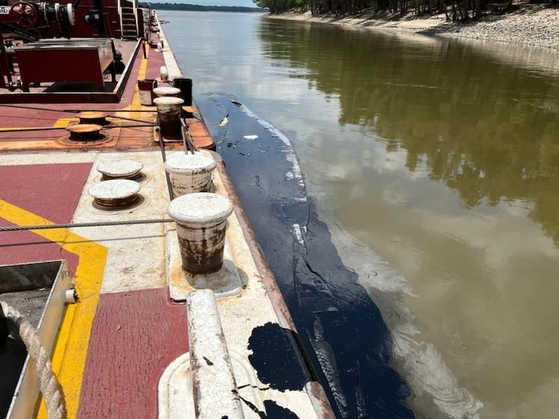 Oil alongside barge in Mississippi River observed on June 11, 2023