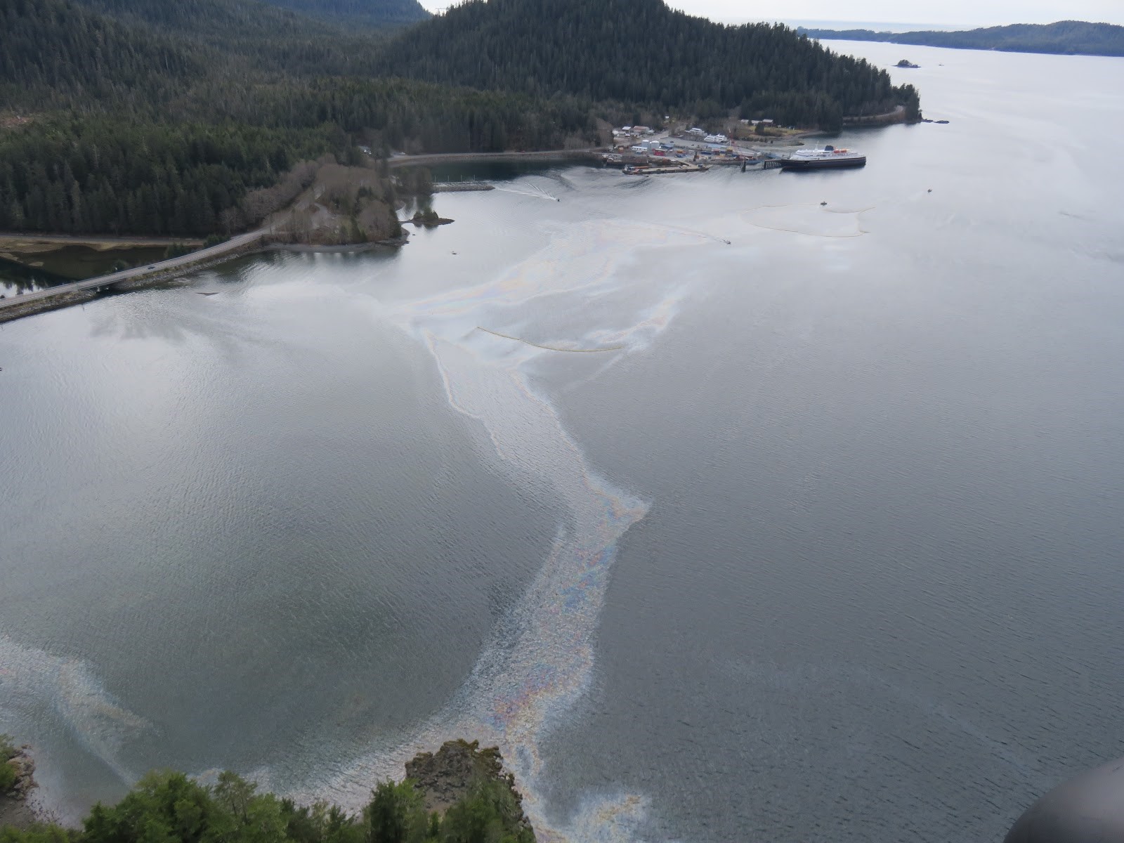 Oil sheen, containment boom, and deflection boom in Starrigavan Bay on April 23, 2017. Image credit: U.S. Coast Guard.