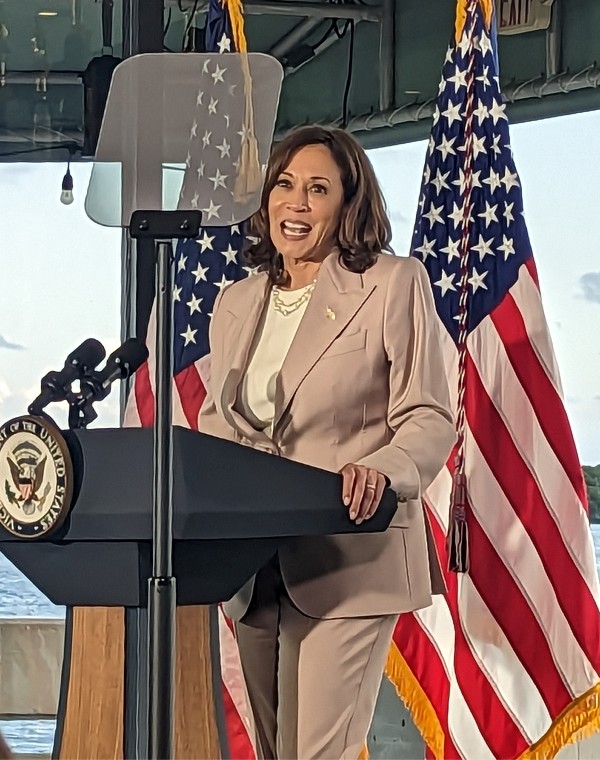 A woman at a podium.