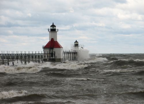 Ocean waves hitting lighthouse.