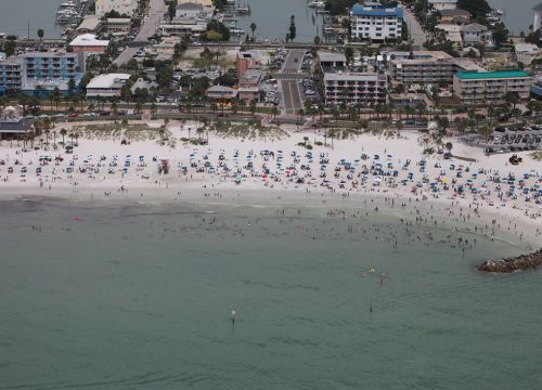 Beach with people and buildings. Image credit: NOAA.