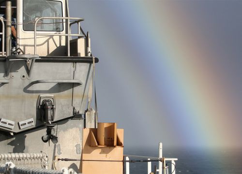 Ship with rainbow.