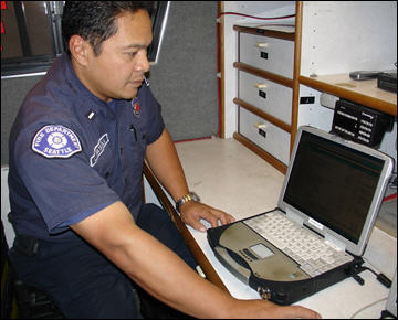 Photo: Seattle firefighter using CAMEO.