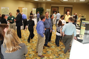 Photo: Several people meetings in a room with posters.